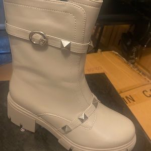 New in the box!! Grey studded boots! Size down!